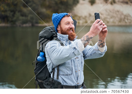 Photographer taking a photo with nature 70567430