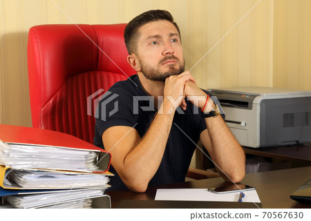 business man thinking at the office at the table business man thinking at the office at the table 70567630