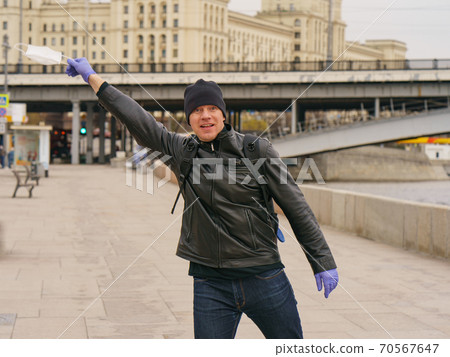 Man does not wearing protective mask outdoors. Coronavirus pandemic time. Man does not wearing protective mask outdoors. Coronavirus pandemic time. 70567647
