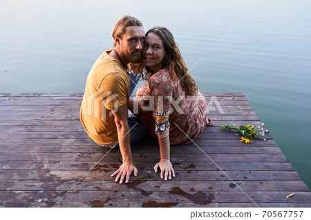 Couple embracing and smiling 70567757