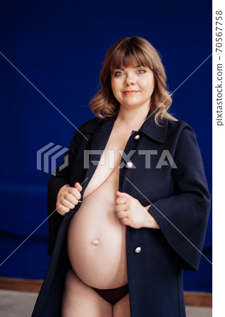 Topless, pregnant with overweight in blue jacket. 70567758