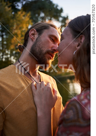 Couple hugging and looking at each other Couple hugging and looking at each other 70567820