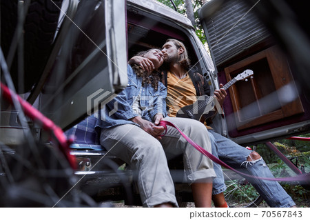 Couple camping outdoors Couple camping outdoors 70567843