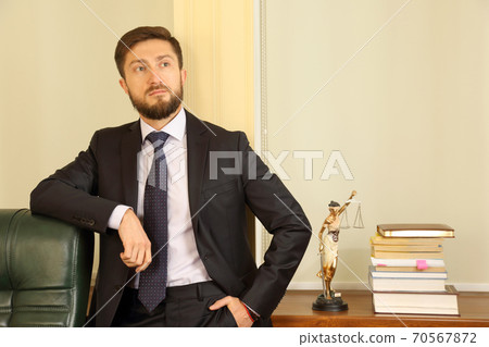 portrait of a young successful lawyer in the office portrait of a young successful lawyer in the office 70567872