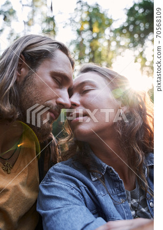 Romantic couple sitting on the roof Romantic couple sitting on the roof 70568109