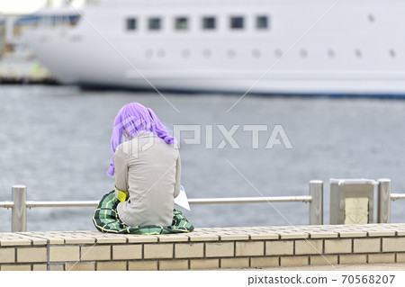 Cosplay woman resting at the beach 70568207