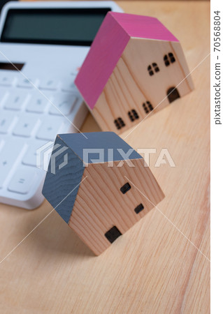 Family house dream concept, while buying a house for loved ones. Family house dream concept, while buying a house for loved ones. 70568804