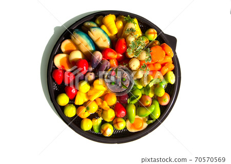 Fruit shaped like a clear glass The inside is made of nuts in jelly that imitates fruit. Is a traditional Thai dessert on white background. 70570569