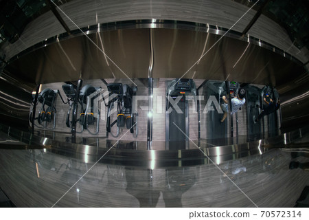 Gym workout, sport and healthy lifestyle ideas A man running on a treadmill A generation of male bodybuilders with a full body trained in cardio exercises. 70572314