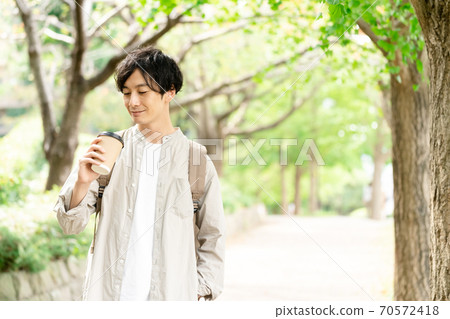 A man taking a walk over coffee A man taking a walk over coffee 70572418