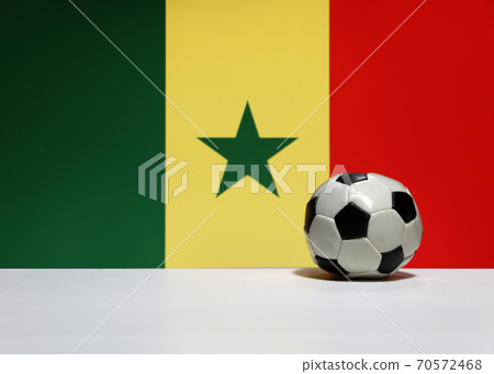 Small football on the white floor and Senegalese nation flag background Small football on the white floor and Senegalese nation flag background 70572468