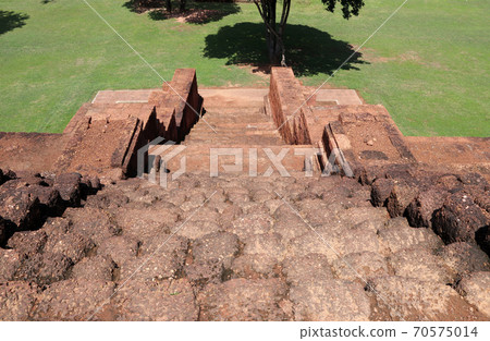 ancient laterite stone stairway down of the base of the main stupa, Khao Klang Nok 70575014