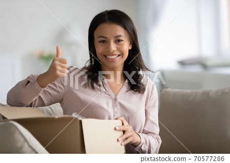 Portrait of smiling biracial woman recommend delivery service Portrait of smiling biracial woman recommend delivery service 70577286