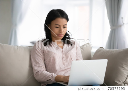 African American woman work on laptop at home African American woman work on laptop at home 70577293