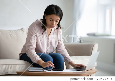African American woman manage budget paying online 70577303