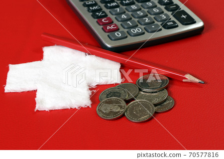Coins of Switzerland with calculator and pencil on the red PVC leather with white cross fabric Coins of Switzerland with calculator and pencil on the red PVC leather with white cross fabric 70577816
