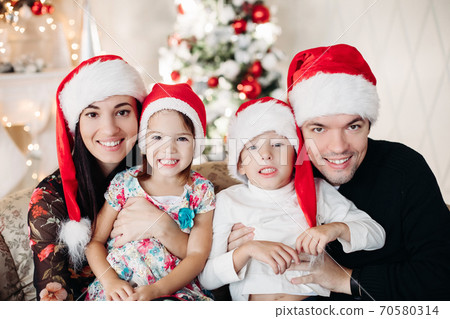Beautiful happy caucasian family. Portrait of 70580314