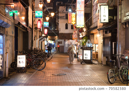Osaka Prefecture A bar area in the back alley of Namba where it rains 70582380