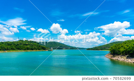 Panorama of Numerous wind turbines in the vast forest with mountains and sky as background at Lam Ta Khong Reservoir, Sikhio, Thailand. 70582699