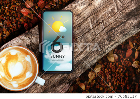 Good Weather on Sunny Day in Fall and Autumn Concept. Mobile Phone with Weather Information. Mobile Phone and Hot Morning Coffee on Timber. Top View Good Weather on Sunny Day in Fall and Autumn Concept. Mobile Phone with Weather Information. Mobile Phone and Hot Morning Coffee on Timber. Top View 70583117