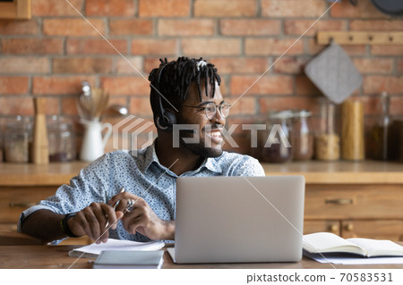 Smiling biracial male student dream at home Smiling biracial male student dream at home 70583531
