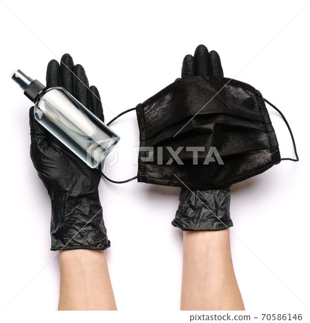 Human hand in protective glove holding face protective masks and alcohol hand sanitizer spray isolated on white background Human hand in protective glove holding face protective masks and alcohol hand sanitizer spray isolated on white background 70586146
