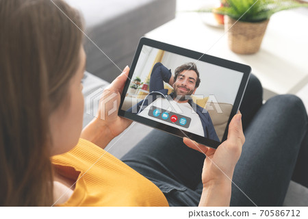 Young woman talking on video chat 70586712