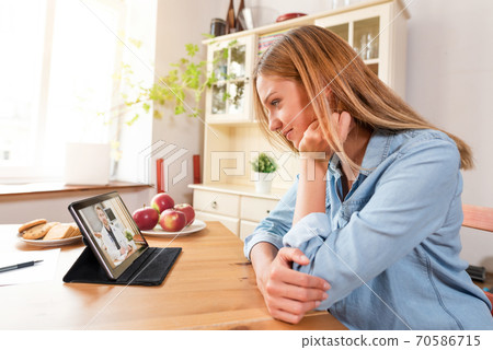 Telehealth concept with doctor on tablet screen Telehealth concept with doctor on tablet screen 70586715