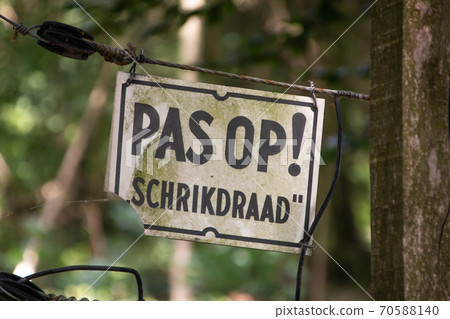Warning sign with the text of a electric fence Warning sign with the text of a electric fence 70588140