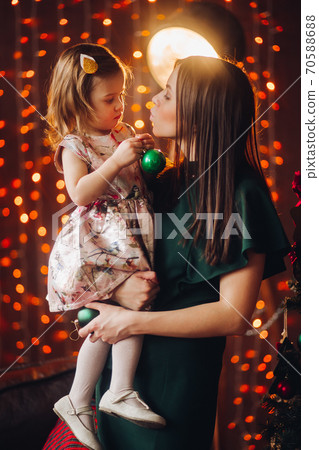 Beautiful woman in with lovely little baby girl. 70588688