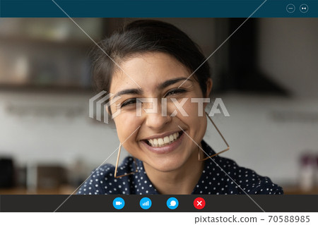 Head shot portrait screen view smiling Indian woman chatting online Head shot portrait screen view smiling Indian woman chatting online 70588985