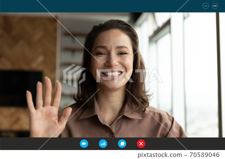 Head shot portrait screen view smiling woman waving hand 70589046
