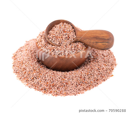 Plantago ovata seeds, isolated on white background. Plantain, indian flea or psyllium seeds in wooden bowl and spoon. Plantago ovata seeds, isolated on white background. Plantain, indian flea or psyllium seeds in wooden bowl and spoon. 70590288