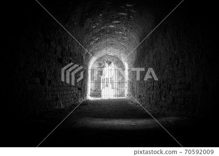 Statue in the light at the end of the tunnel Statue in the light at the end of the tunnel 70592009