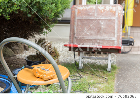 Unloading machine at construction site 70592065