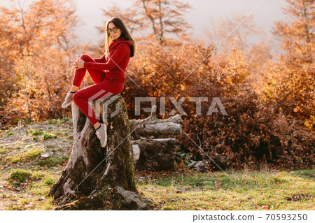 woman relax in autumn forest 70593250