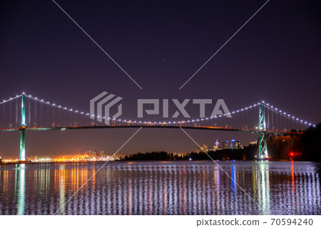 Night view photo of the center of Lions Gate Bridge Vancouver British Columbia Canada Night view photo of the center of Lions Gate Bridge Vancouver British Columbia Canada 70594240