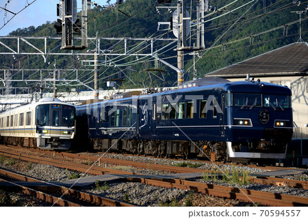 Series 221 Rapid and Series 117 West Express Ginga on the JR Kyoto Line Series 221 Rapid and Series 117 West Express Ginga on the JR Kyoto Line 70594557