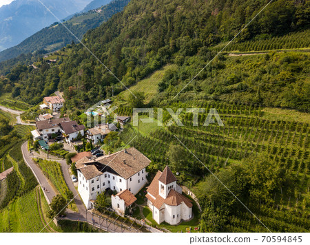 Aerial photo of the idyllic little church of St. Peter of Meran / Merano in south Tyrol, Italy along the Tappeiner path Aerial photo of the idyllic little church of St. Peter of Meran / Merano in south Tyrol, Italy along the Tappeiner path 70594845