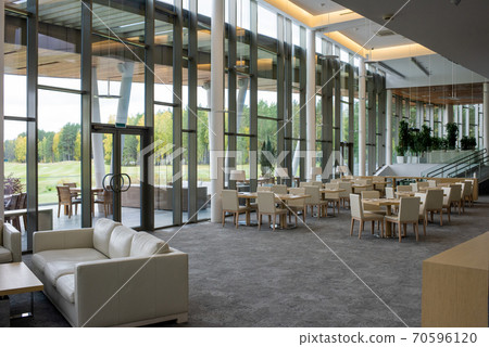 Interior of large luxurious restaurant inside contemporary business center 70596120