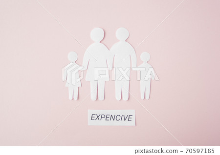 paper family cut out on bright pink background, family home 70597185