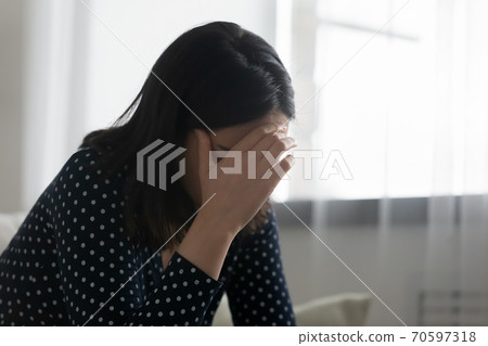 Upset woman feel distressed after relations problems 70597318