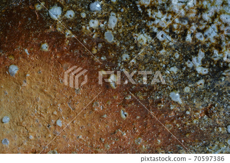 The surface of Shigaraki ware with scarlet color The surface of Shigaraki ware with scarlet color 70597386