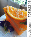 Piece of Orange cake on white dish 70598246