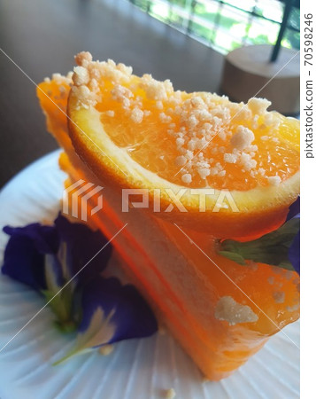 Piece of Orange cake on white dish Piece of Orange cake on white dish 70598246
