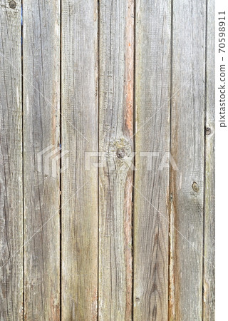 Old plank wooden unpainted gray fence 70598911