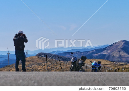 A man taking a commemorative photo with Shikoku Karst Touring 70602360