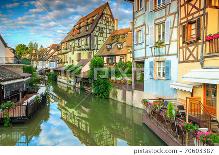 Amazing medieval half-timbered facades reflecting in water, Colmar, France 70603387