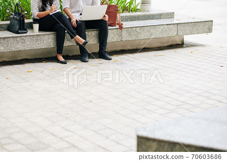 Business people working outdoors 70603686