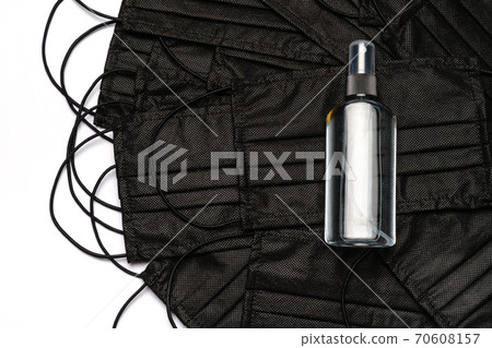 bottle of lotion, sanitizer or liquid soap and medical protective masks over white background bottle of lotion, sanitizer or liquid soap and medical protective masks over white background 70608157